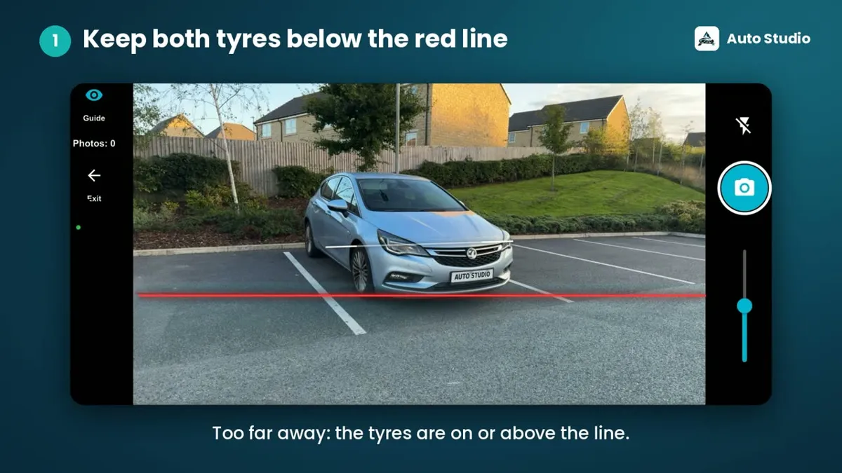 Auto Studio camera screen with a car in a car park and a red line across the lower part of the frame, captioned keep both tyres below the red line