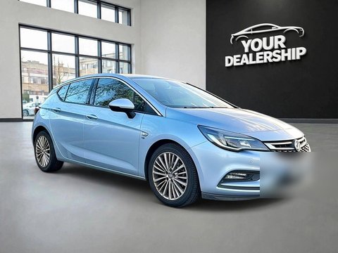 After: the same three-quarter shot on a dealership showroom background