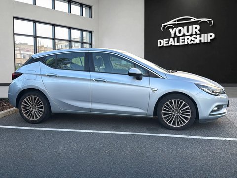 After: the same side profile with the background replaced by a branded dealership scene